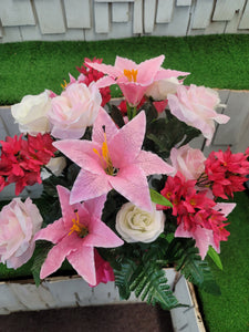 Pink tiger lily and cream rose silk cemetery bouquet in a cone vase