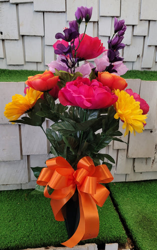Yellow daisy, pink peony, and orange ranunculus silk cemetery bouquet in a cone vase