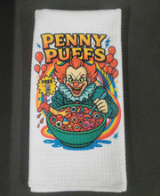 Load image into Gallery viewer, Towel with a clown eating cereal design labeled &#39;Penny Puffs&#39; on a white background