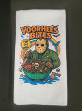 Load image into Gallery viewer, Towel with a graphic design of a character eating cereal labeled &#39;Voorhees Bites&#39; on a white background.