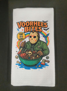 Towel with a graphic design of a character eating cereal labeled 'Voorhees Bites' on a white background.